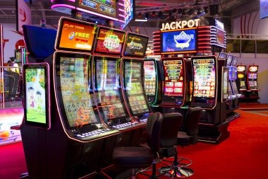 Monopoly Live studio with professional host, physical wheel, and live betting interface on olx69